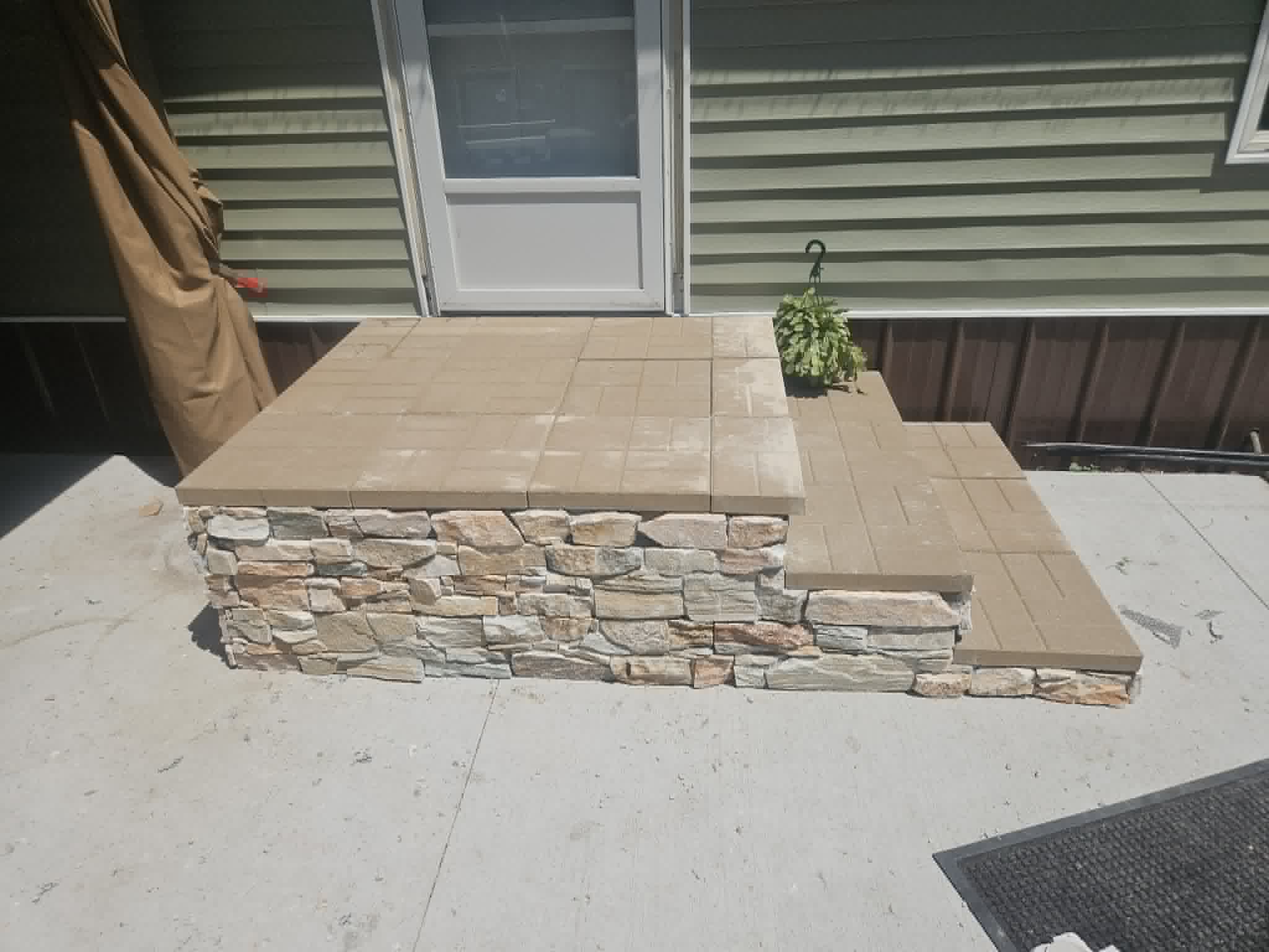Refreshed entry of new paver steps with clean and modern lines